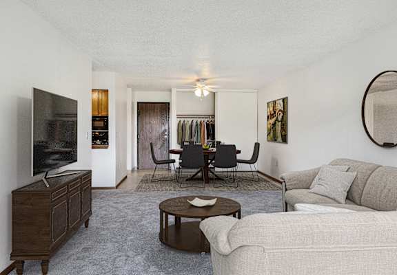 a living room with a couch and a table and a television