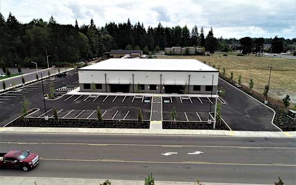 an empty parking lot in front of a building
