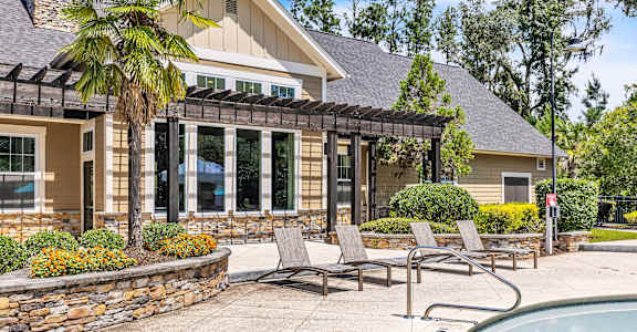 A house with a pool and a patio area.