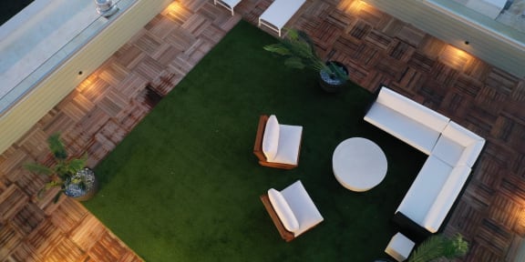 a roof top view of a living room with grass