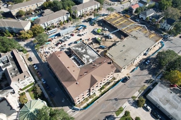 an aerial view of a building under construction in a city