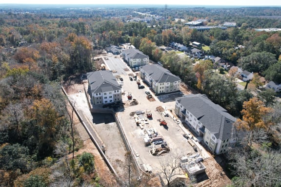 an aerial view of a neighborhood with houses and a construction site