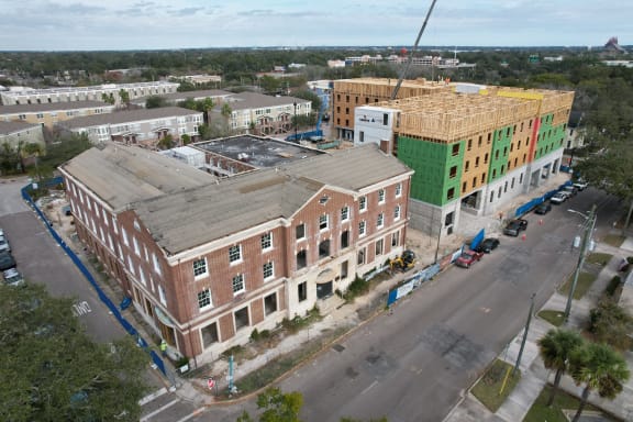 an aerial view of a building under construction in a city