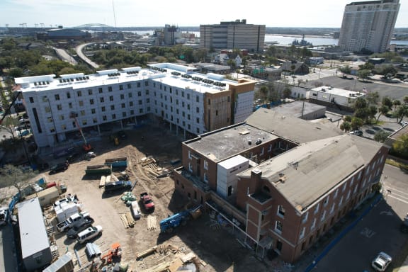 an aerial view of a building under construction in a city