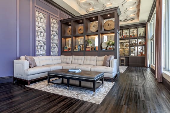 a living room filled with furniture and a large window