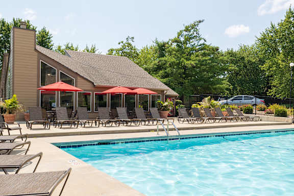 A spacious pool and lounge area at Skyler Ridge Apartments, ideal for enjoying the outdoors with comfort.