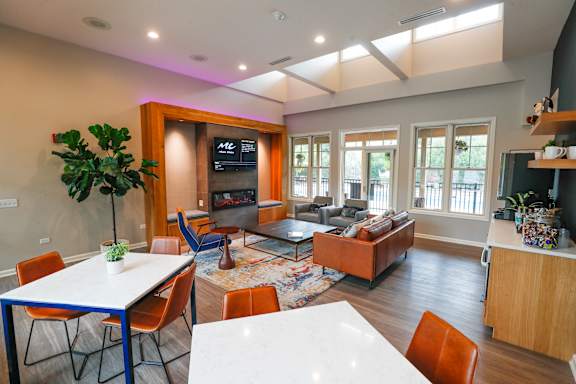 A living room with a white table and chairs.