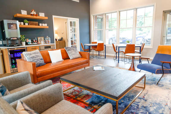 A living room with a grey couch and a coffee table.