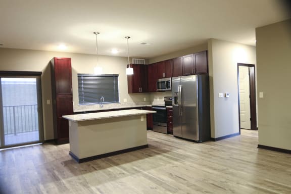 Spacious kitchen with granite countertops in a 3 bedroom apartment for rent at North Pointe Villas best new apartments Lincoln NE 68521