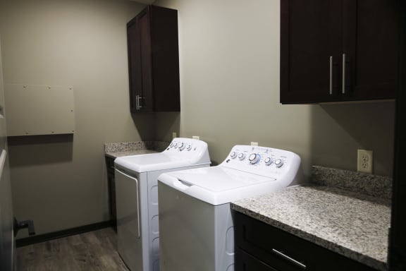 Private laundry room with washer and dryer included in the Harrison floor plan at North Pointe Villas best apartments Lincoln NE 68521