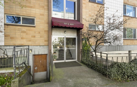 the entrance to a building with a wooden door