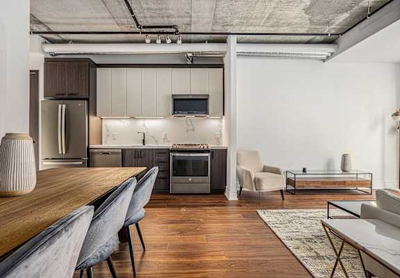 a kitchen and dining area in a 555 waverly unit