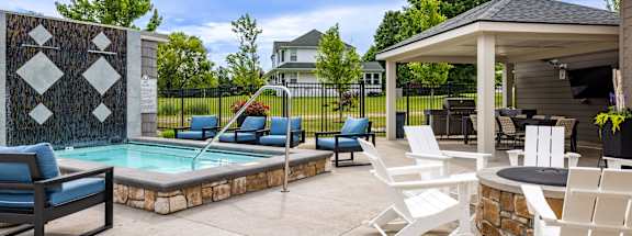 Swimming pool and hot tub at Quarry Apartments and Townhomes in DeWitt, Michigan