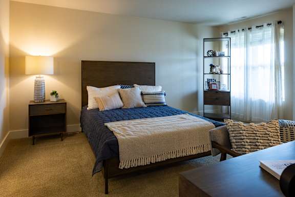 Bedroom at Quarry Apartments and Townhomes in DeWitt, Michigan