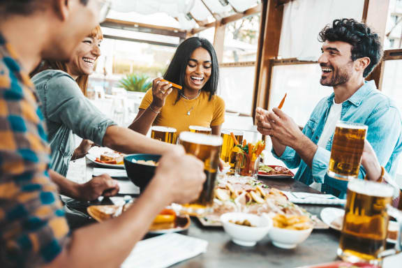 people sitting at a table eating and drinking beer at The Walker Virginia Center in Virginia 23059