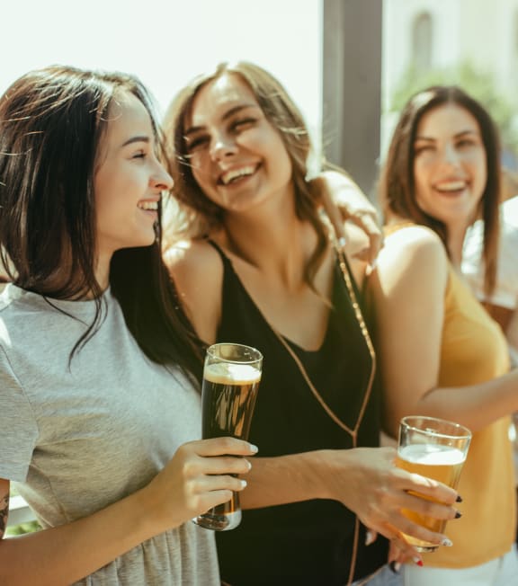 group of people drinking beer in a bar