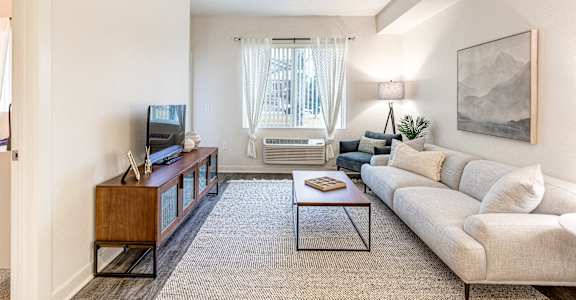 a living room with a couch and a coffee table