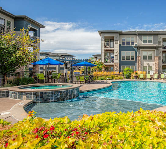 Swimming Pool with Sun Deck and Chairs