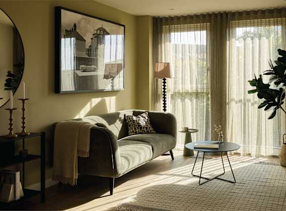 a living room and dining room with a table and chairs