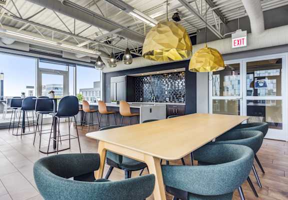 A conference room with a long table and chairs.