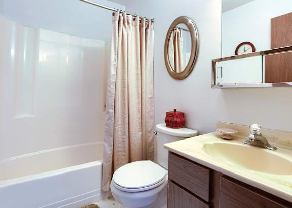 a bathroom with a toilet sink and bathtub