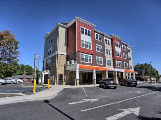 a large building on the corner of a parking lot
