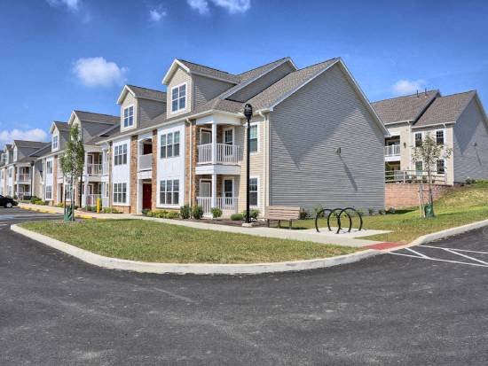 a row of houses on the side of a street