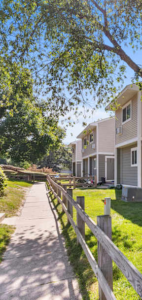 A residential area with houses and a clear sky.