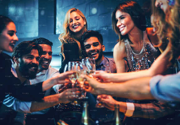 a group of people drinking wine at a party