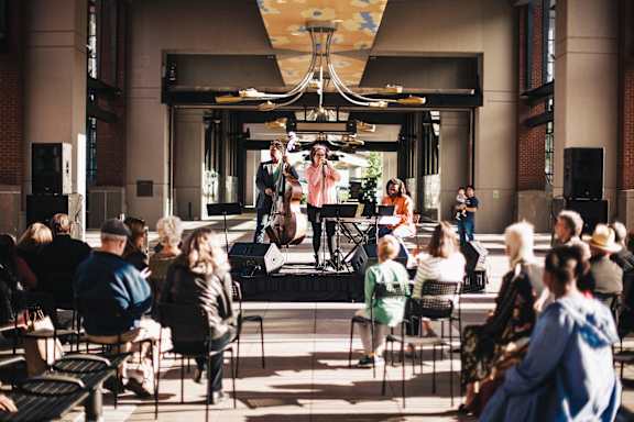 a group of people sitting in front of a crowd