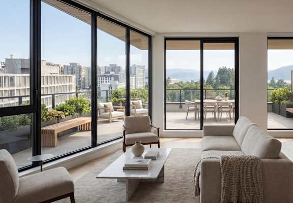A modern living room with a view of the city.