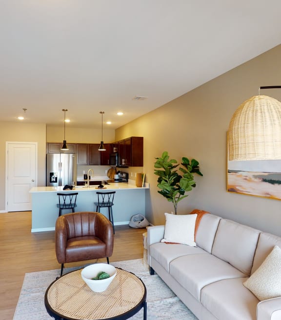 a living room with a couch and a table with chairs