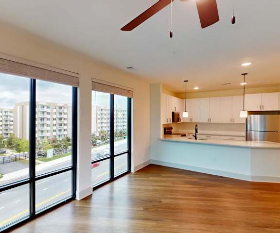 A modern kitchen with a view of the street outside.