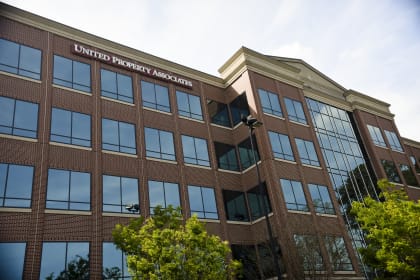 a large brick building with a sign that reads united property attorneys