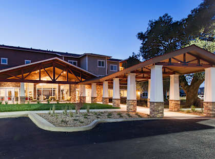 Entrance at dusk at The Lodge at Morgan Hills Apartments in Morgan Hill CA
