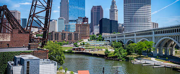 a view of the city with a bridge and a river
