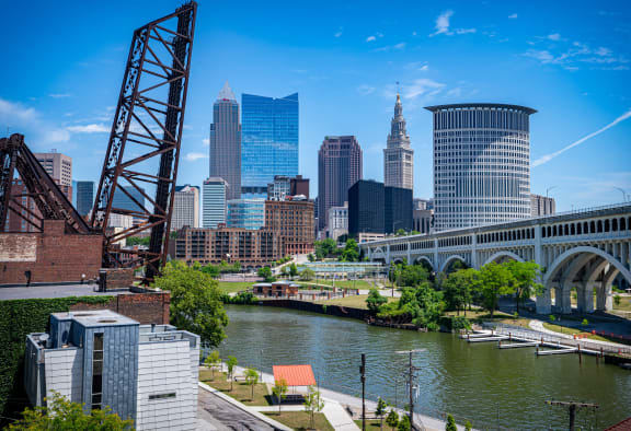 a view of the city with a bridge and a river