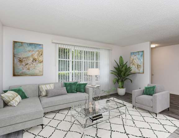 a living room with a couch and a ceiling fan