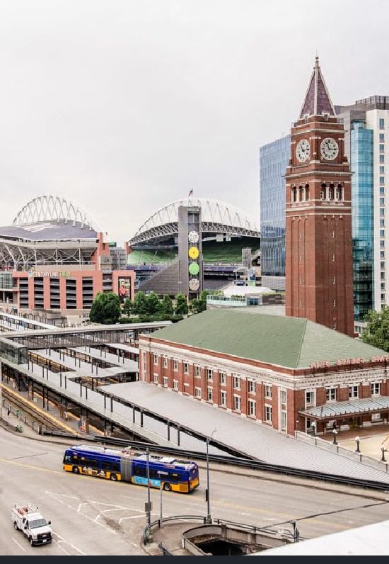 a train station with a clock tower in a city at Icon Apartments, Washington, 98104