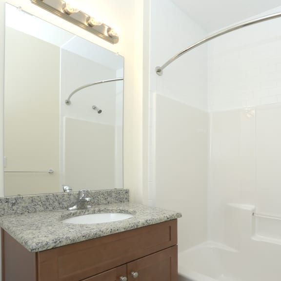 this is a photo of the bathroom in a 1 bedroom apartment at deer hill apartments in c at Greenway Village Apartments, Metuchen, New Jersey