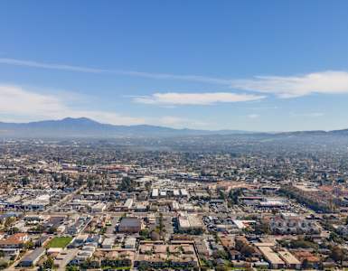 A cityscape with a clear blue sky above.
