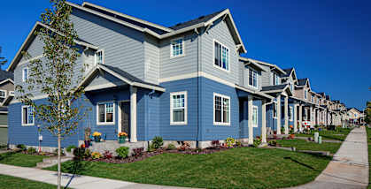 Property exteriors and sidewalk at The Landing Apartments, Oregon