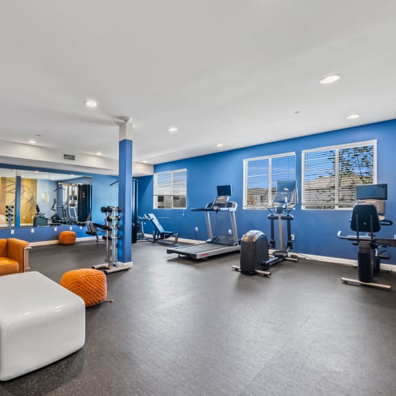 a workout room at the bradley braddock road station apartments