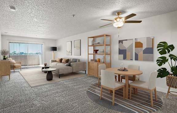 A modern living room with a grey rug and a grey sofa.