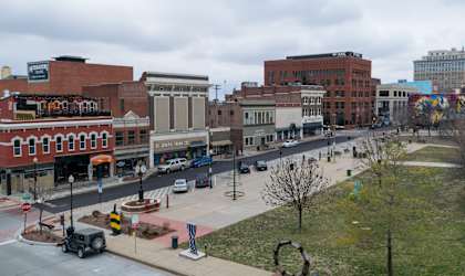 a view of a city street from the roof of a building