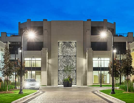 a building with street lights and a car on the street