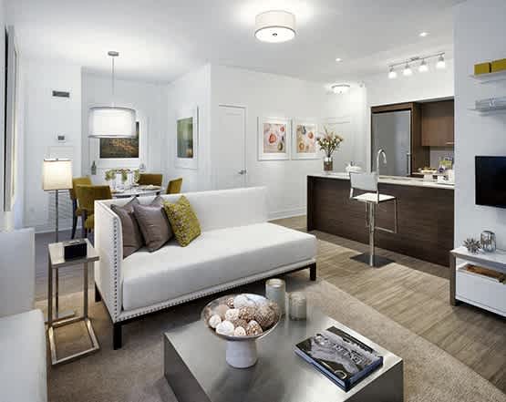 a living room and kitchen in a modern apartment