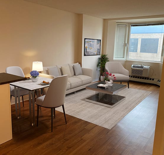a living room and dining room with a couch and a table