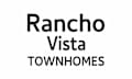 A black and white image with the words Rancho Vista Townhomes.