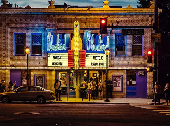 a group of people standing in front of a building